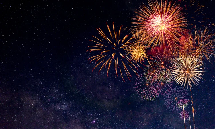 Red and gold fireworks lighting up the night sky